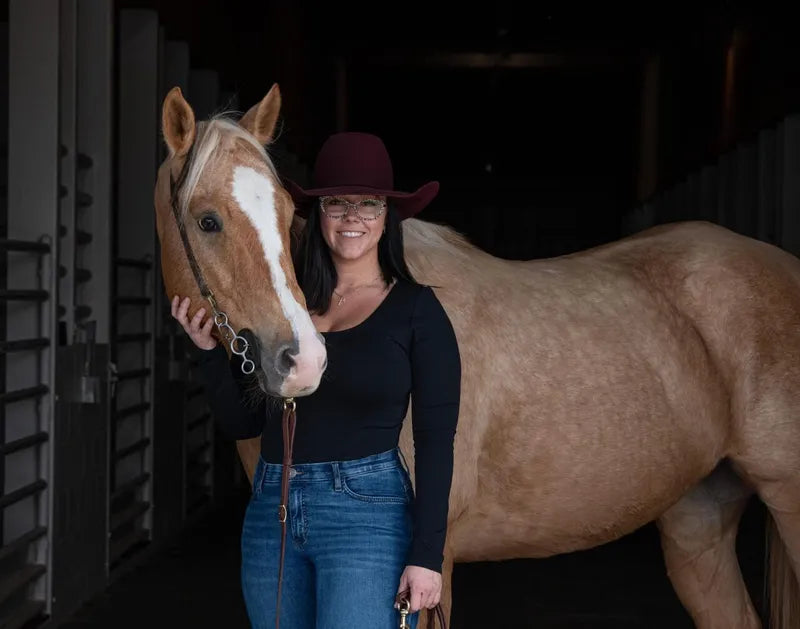 Western rider Deahanna Raynes with palomino horse