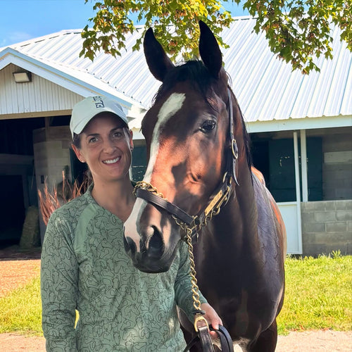 Katherine Wheeler, Dapple Up founder, with horse at the barn